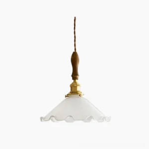 Ruffled glass pendant light with frosted white shade, solid walnut wood and polished brass fixture, overhead flat lay view on white background