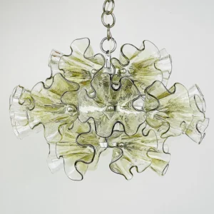 Close-up detail of ruffled glass pendant chandelier showing textured rippled glass petals and chrome hanging chain