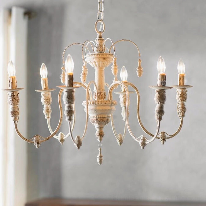 Close-up of six-arm rustic candelabra chandelier with aged cream-bronze twisted metal arms