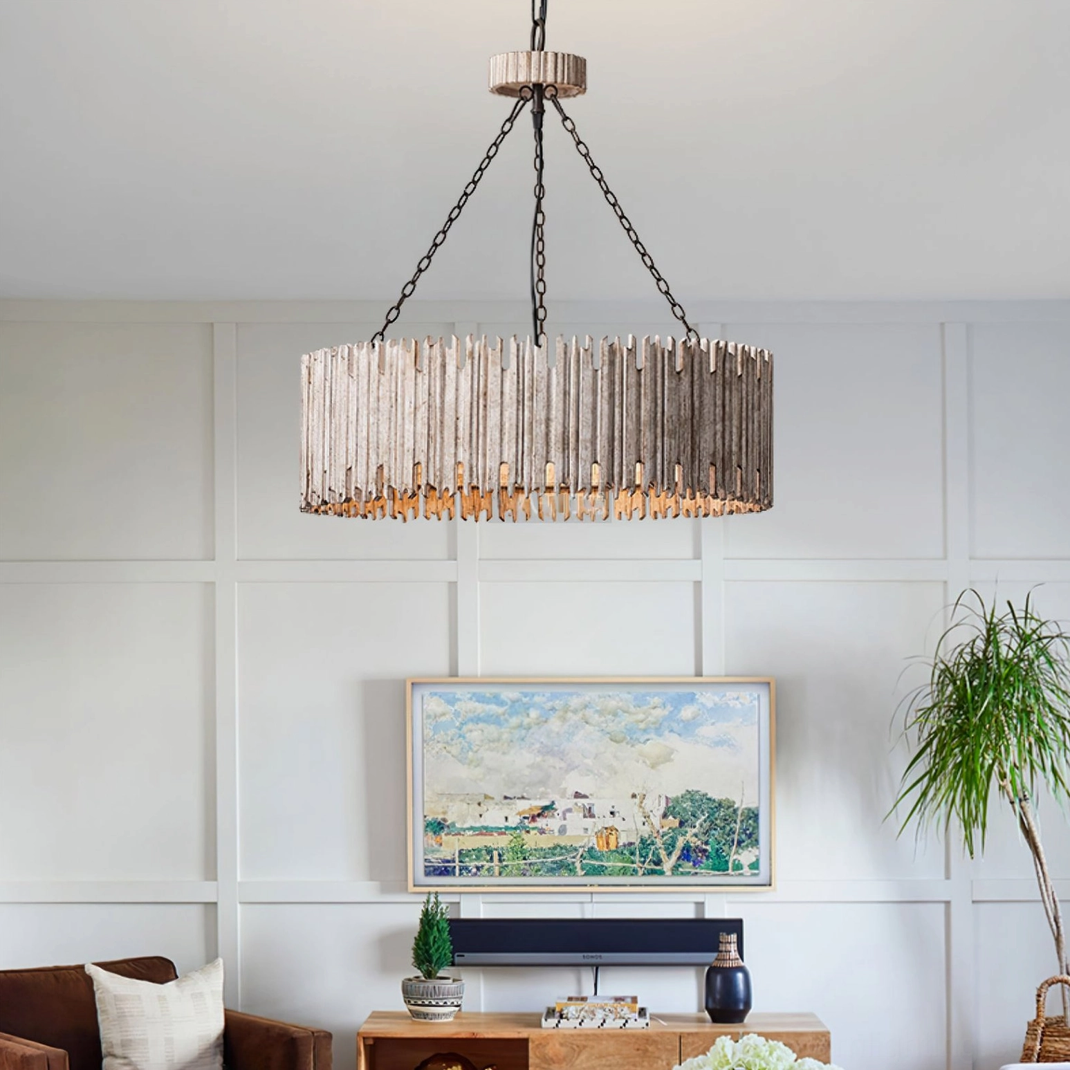 Rustic drum chandelier in modern farmhouse living room with wall art, side front view of whitewashed wood drum shade
