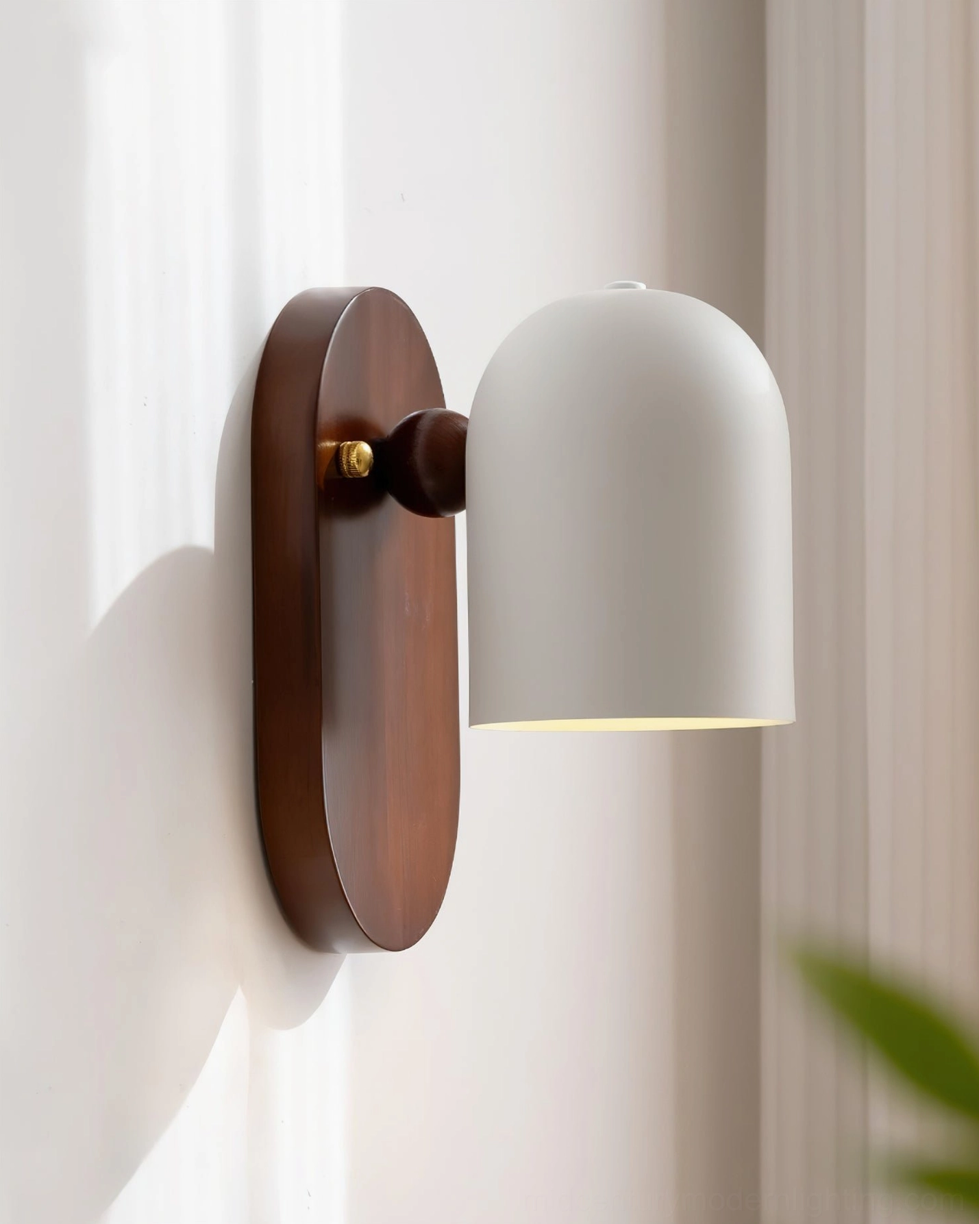 Sable wall lamp in sunlit interior featuring walnut wood elements and clean geometric design