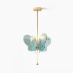 Sabrina Butterfly Pendant Lamp in blue marbled glass with brass gold frame, front studio view showing symmetric wing design