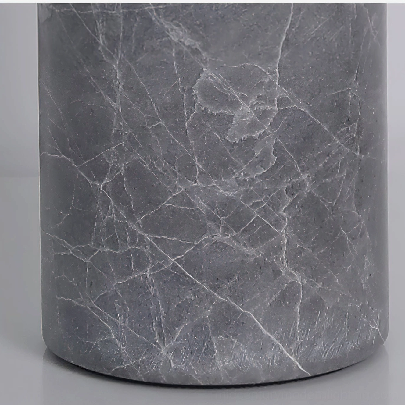Grey marble with white natural veining close-up detail, cylindrical solid stone base of Sacha table lamp, stone craftsmanship