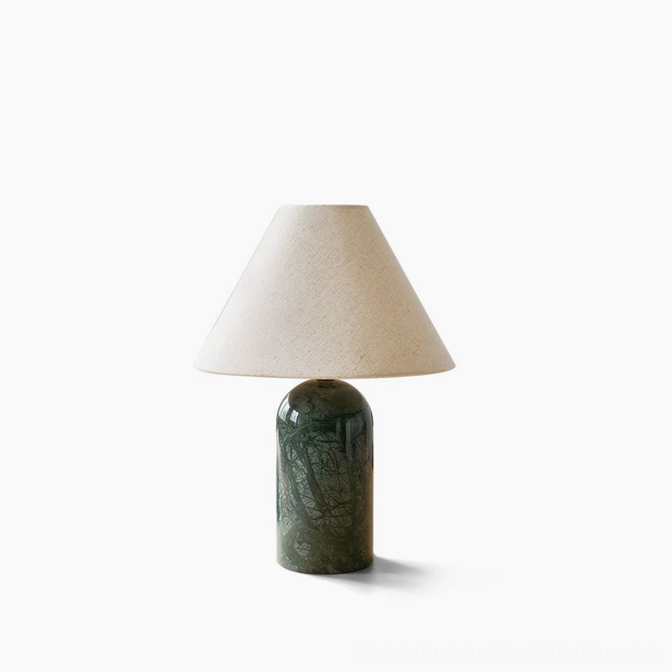 Sacha marble table lamp with dark green cylindrical marble base and beige conical fabric shade, front studio view on white background, Mid-Century Modern design