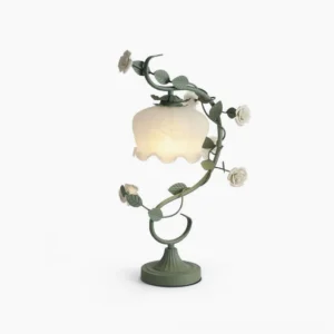 Sage green rose vine table lamp with ruffled frosted milk-white glass shade, front view on pure white background