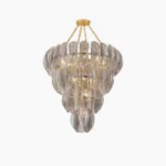 Salinger cascading glass chandelier studio product shot with tiered smoke gray glass panels and warm brushed gold frame on white background