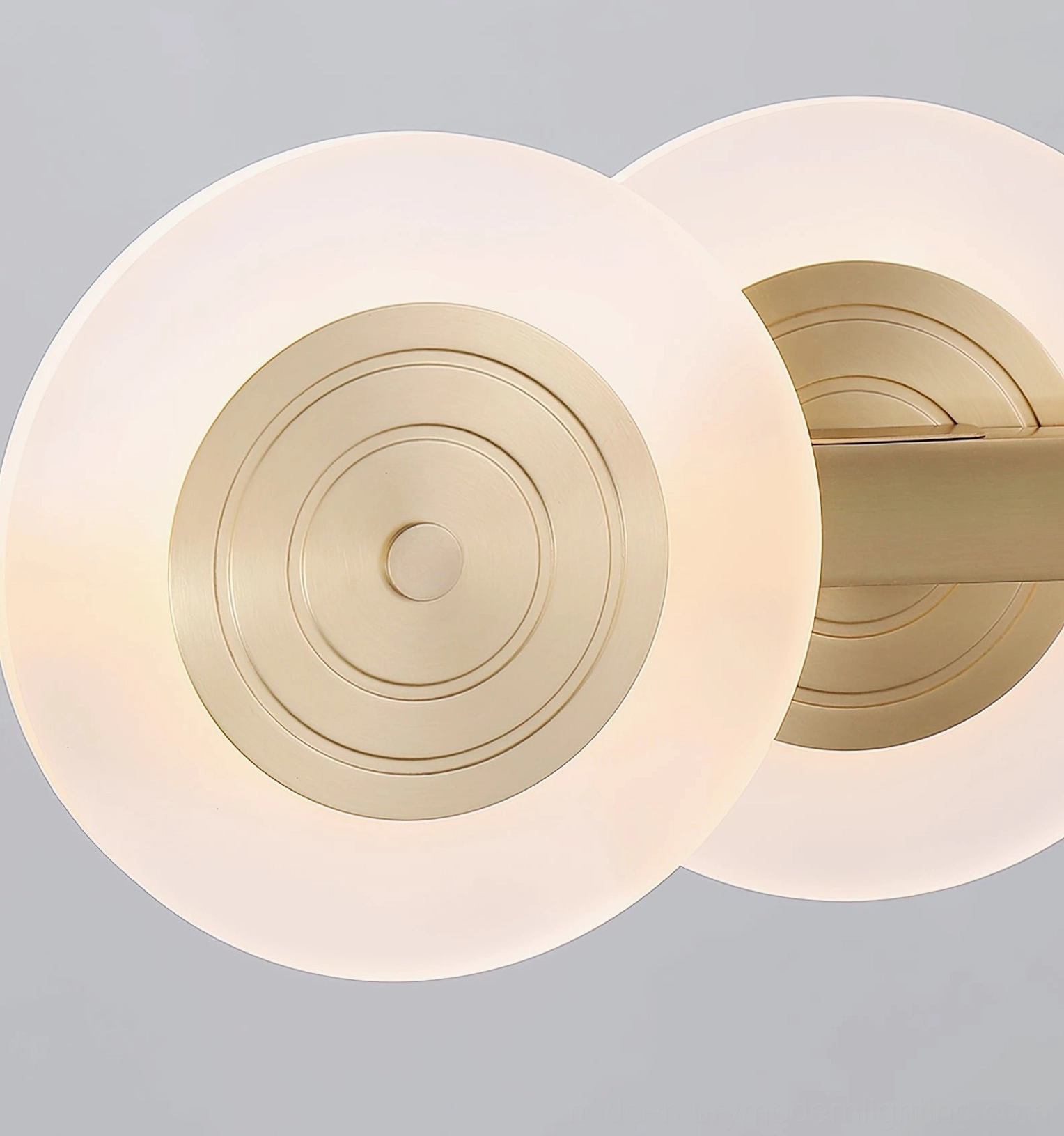 Samiya chandelier close-up of acrylic shades, concentric brass detail, frosted white acrylic material