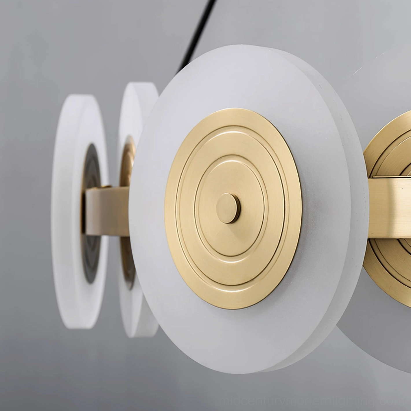 Close-up detail of Samiya chandelier lampshade, concentric brass and frosted acrylic design
