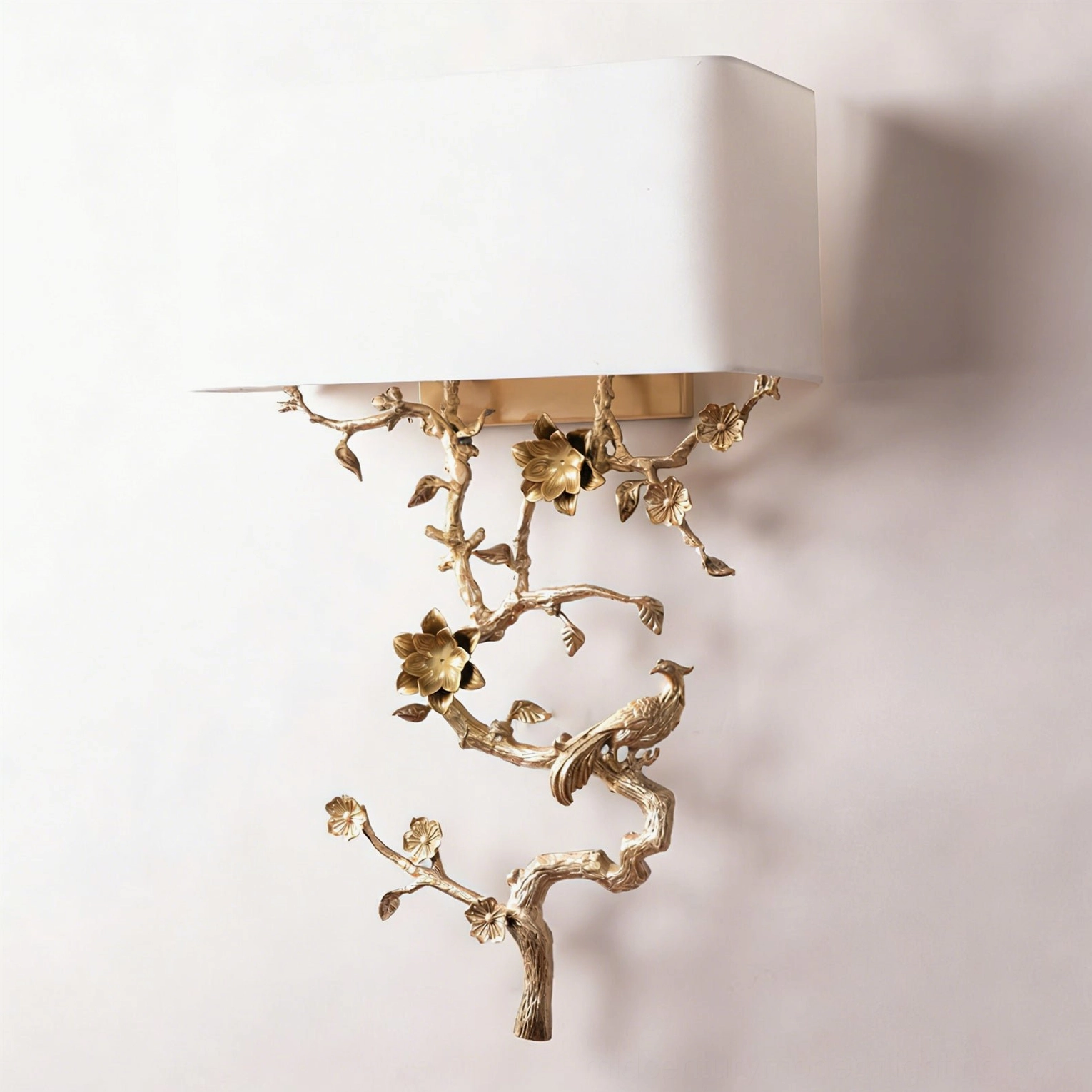 Sanremo brass wall sconce side profile view showcasing sculptural branch-inspired design and hidden wall mounting base