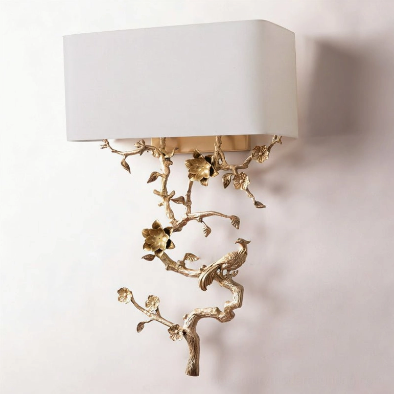 Sanremo wall light unlit front angle showing matte white fabric shade and detailed hand-crafted brass decorative frame structure