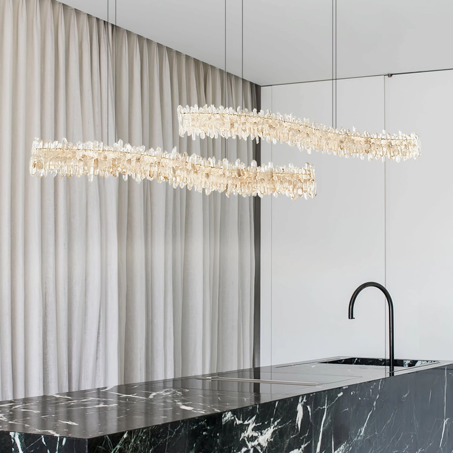 Sarella Crystal Chandelier above marble kitchen counter matching black modern faucet and minimalist styling