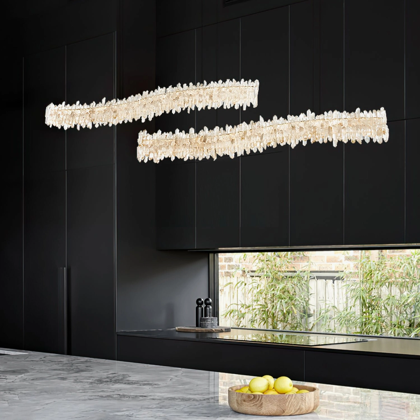 Sarella Square Chandelier in dark modern kitchen creating dramatic contrast with black cabinetry and rose gold finish