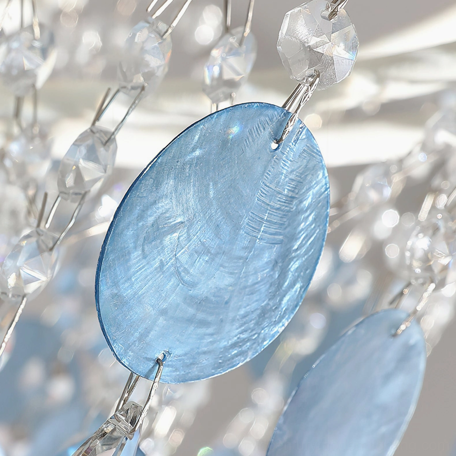 Sasha Capiz Bead Chandelier showcasing concentric ring structure and shadow-free ambient light diffusion technology
