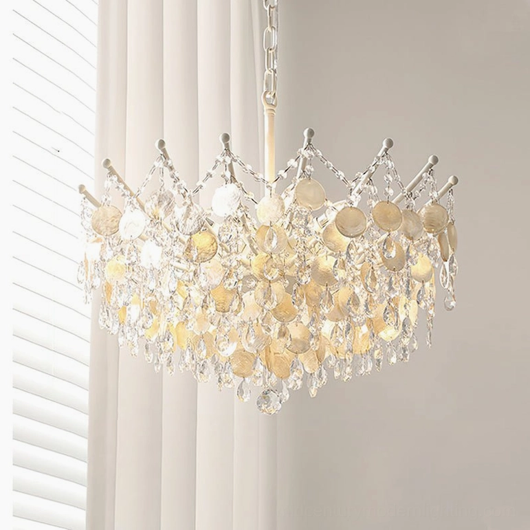 Small Sasha Capiz Bead Chandelier in soft gold finish, front view against white shutter backdrop