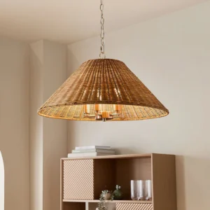 Saskia rattan pendant light suspended in minimalist bohemian interior with wooden shelving, warm ambient lighting effect