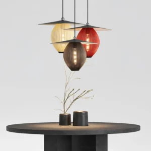 Three Satellite pendant lights in different color finishes displayed overhead tabletop arrangement