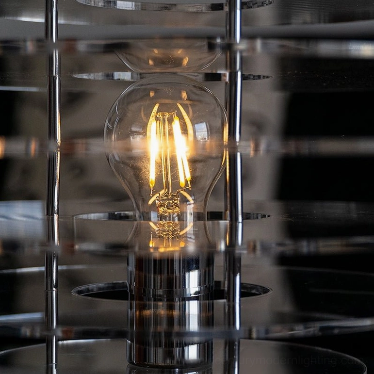 Close-up macro front view of Saturn lamp fixture - vintage Edison bulb detail and metal frame