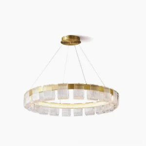 Saturno modern LED ring chandelier with brass gold finish and clear faceted acrylic shades, front studio view