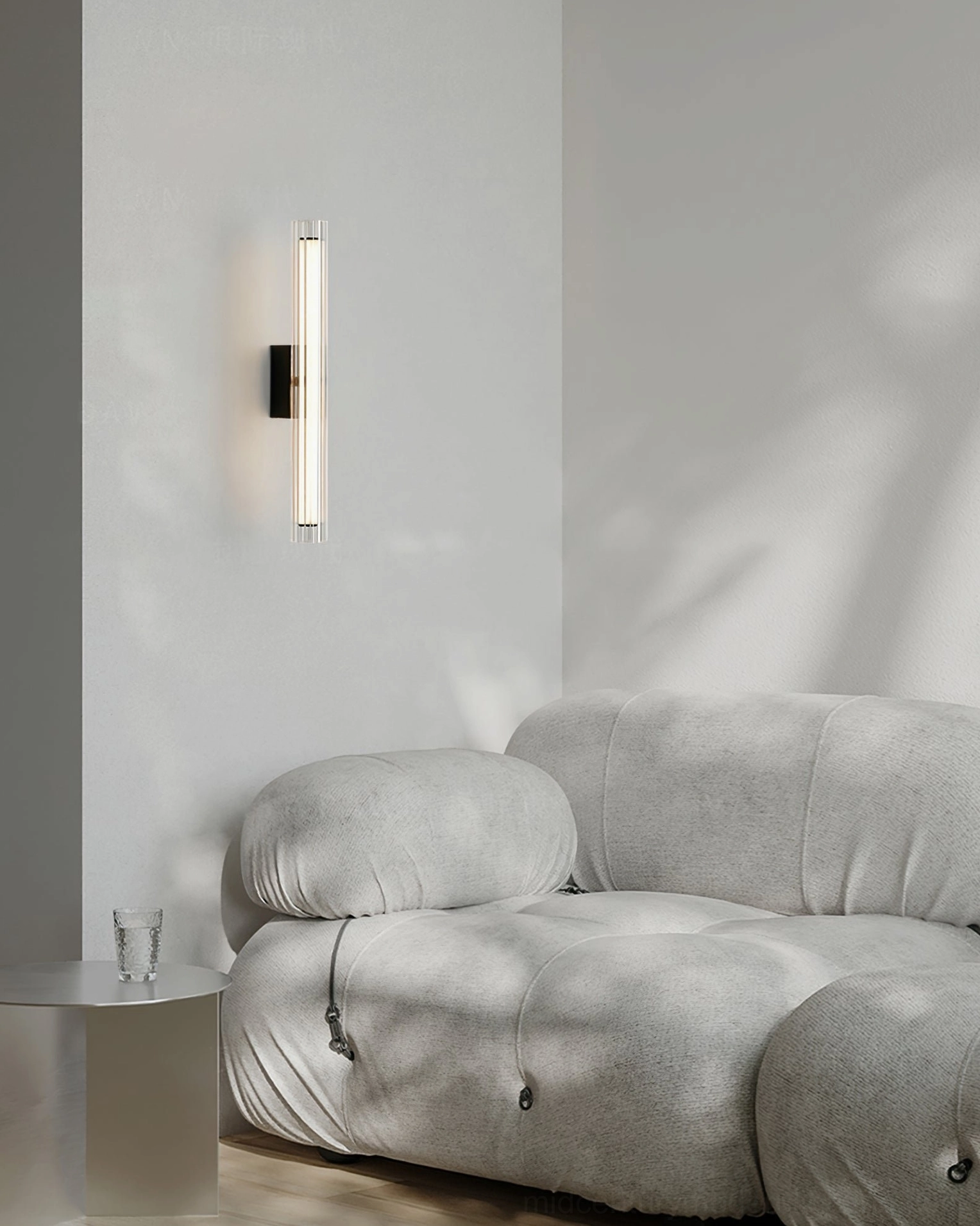Saxon vertical sconce warm light diffusion through fluted glass shade
