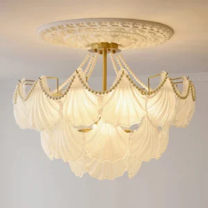 Scallop shell glass chandelier installed in modern living room ceiling with carved medallion, ambient warm lighting