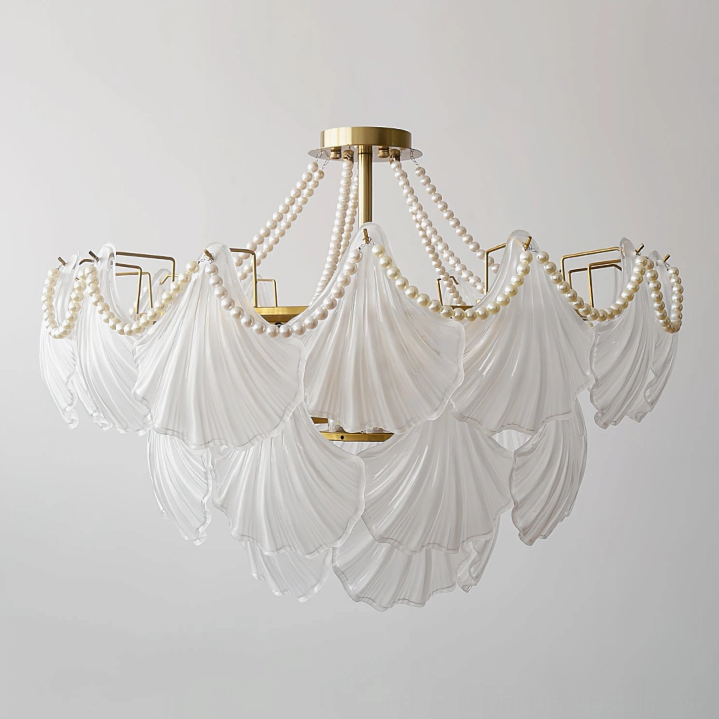Scallop shell chandelier showcase displaying multiple size options and configurations in showroom setting
