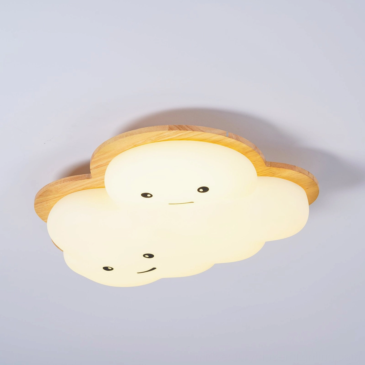 Smiling cloud ceiling lamp in Scandinavian minimalist bedroom with neutral palette and soft furnishings