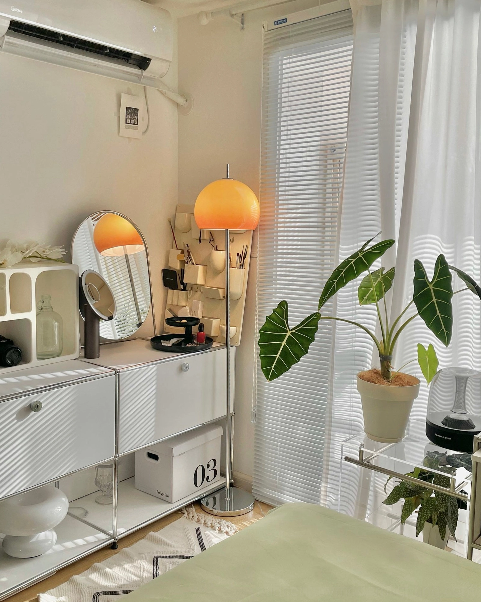 Mid-century mushroom floor lamp in Scandinavian bedroom with white vanity and minimalist decor