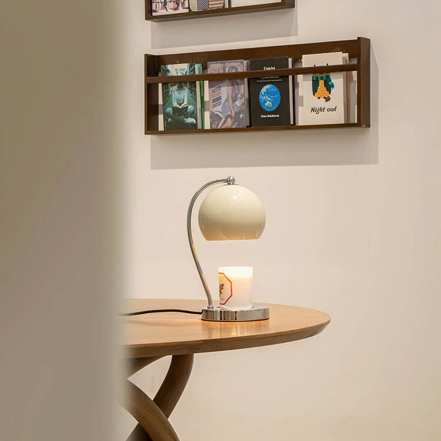 Off-white spherical lamp with minimalist retro design on wooden side table bedroom setting