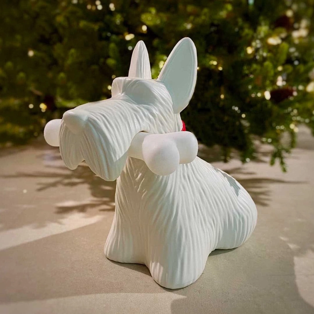 Black Scottie terrier lamp three-quarter view showing sculptural anatomy and light integration