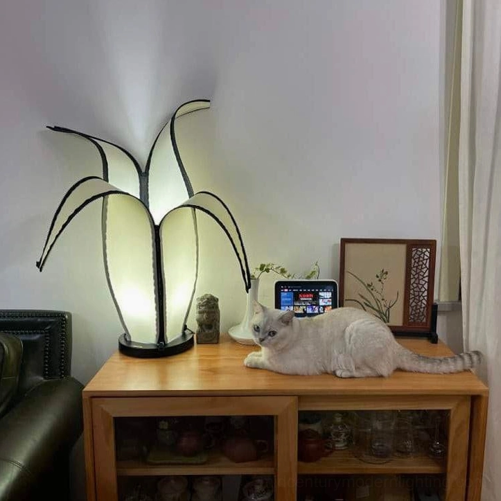 Sculptural banana-shaped table lamp in black and white mid-century modern style