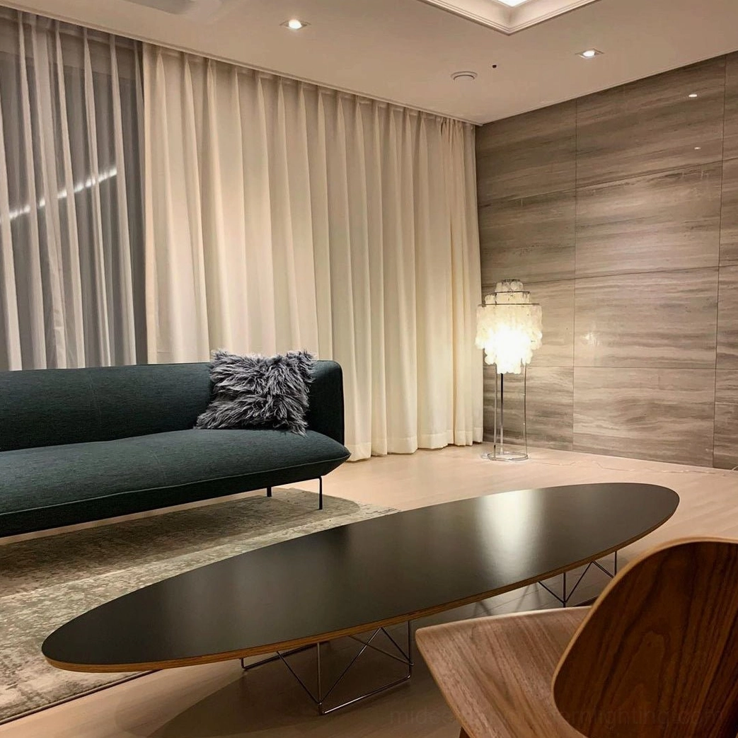 Sculptural shell floor lamp with geometric tiered composition and artistic form
