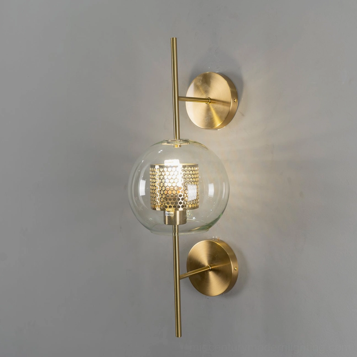 Modern glass wall sconce with sculptural presence and soft ambient lighting