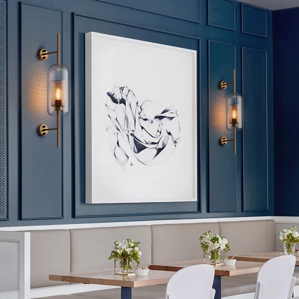 Contemporary glass wall sconce with sculptural silhouette and warm ambient glow
