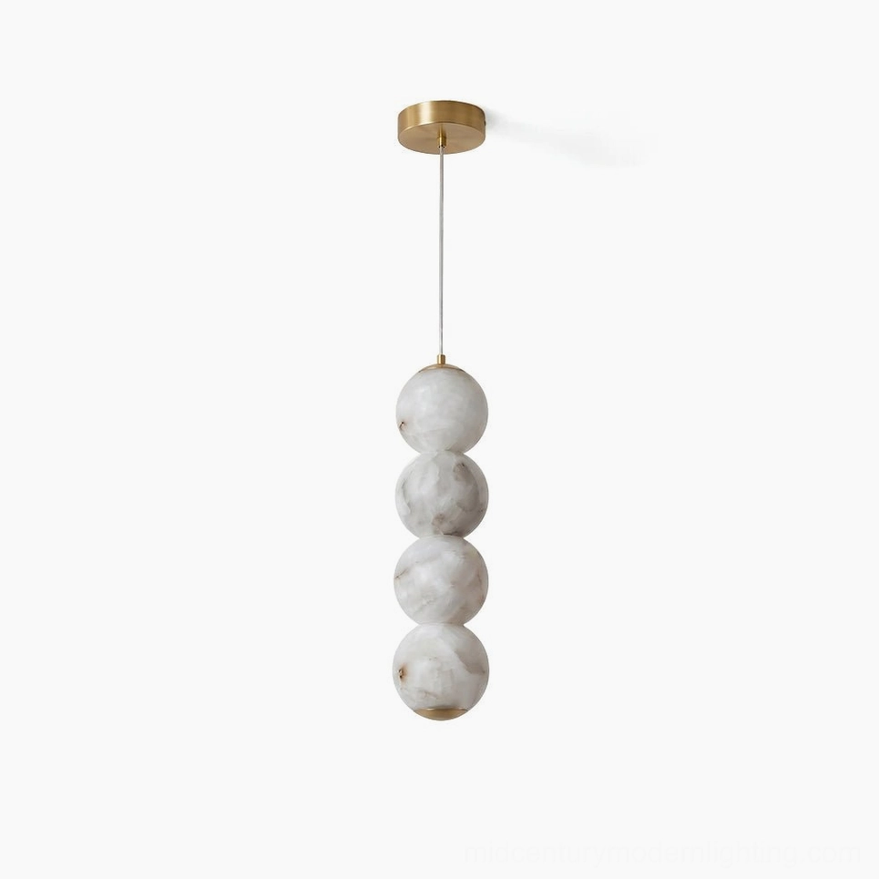 Sculptural stacked alabaster pendant light vertical totem modern interior focal point