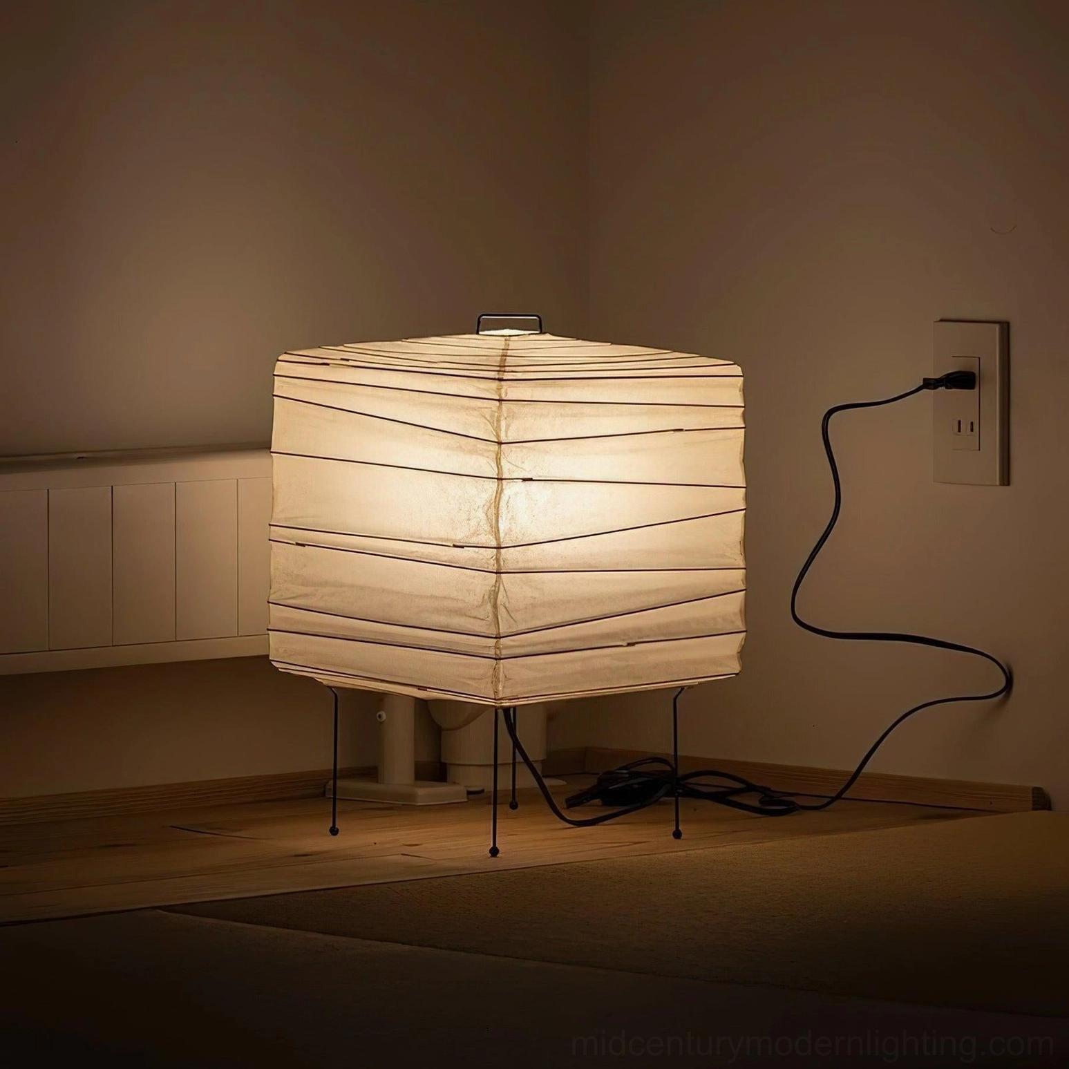 Contemporary washi paper table lamp showing three-dimensional sculptural form and soft ambient light through handmade paper diffuser