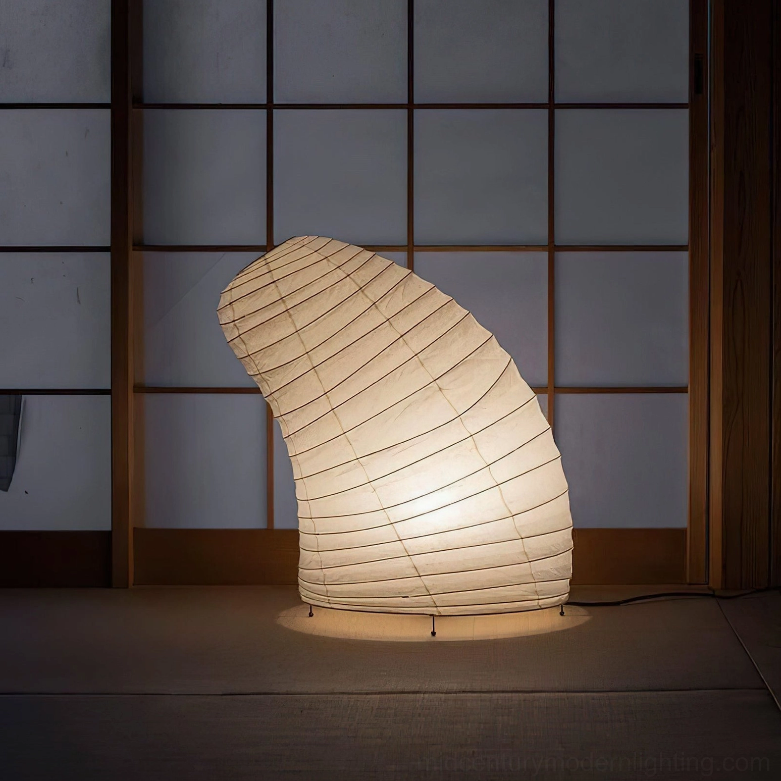 Handcrafted washi paper sculptural table lamp with organic biomorphic silhouette, showcasing premium mulberry paper and metal frame construction