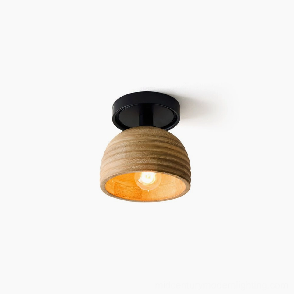 Sculptural wood ceiling lamp with ribbed texture, side low-angle view showcasing dome shape and vertical wood detailing against white backdrop