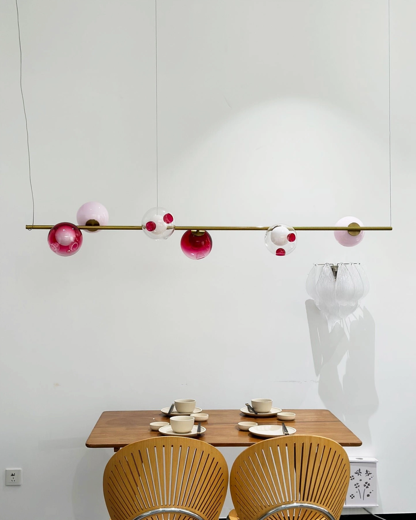Sedna linear chandelier architectural lighting design shot - geometric glass sphere composition in modern pendant formation