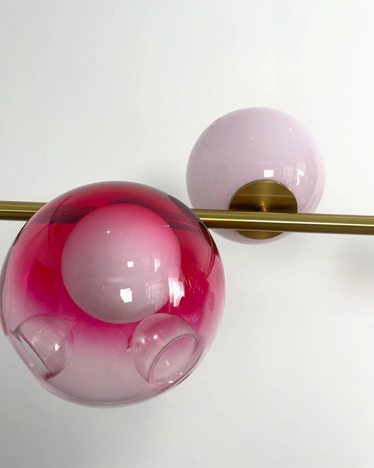 Sedna linear chandelier mixed glass globe palette - golden, blush pink, deep red, white and crystal clear spheres detail