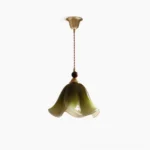 Selene mid-century modern botanical pendant light with sage green gradient glass shade and brass fittings, front view on white background