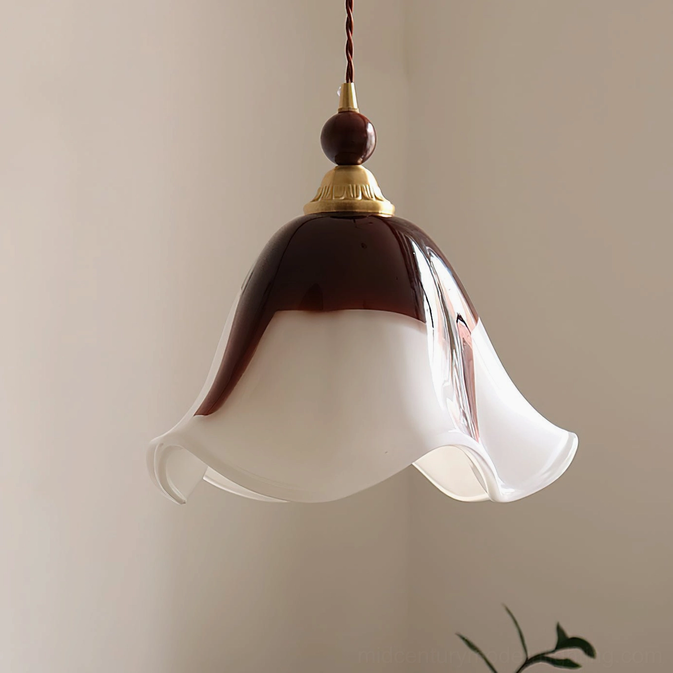 Cream and brown two-tone Selene pendant light with wavy glass shade in mid-century modern interior design