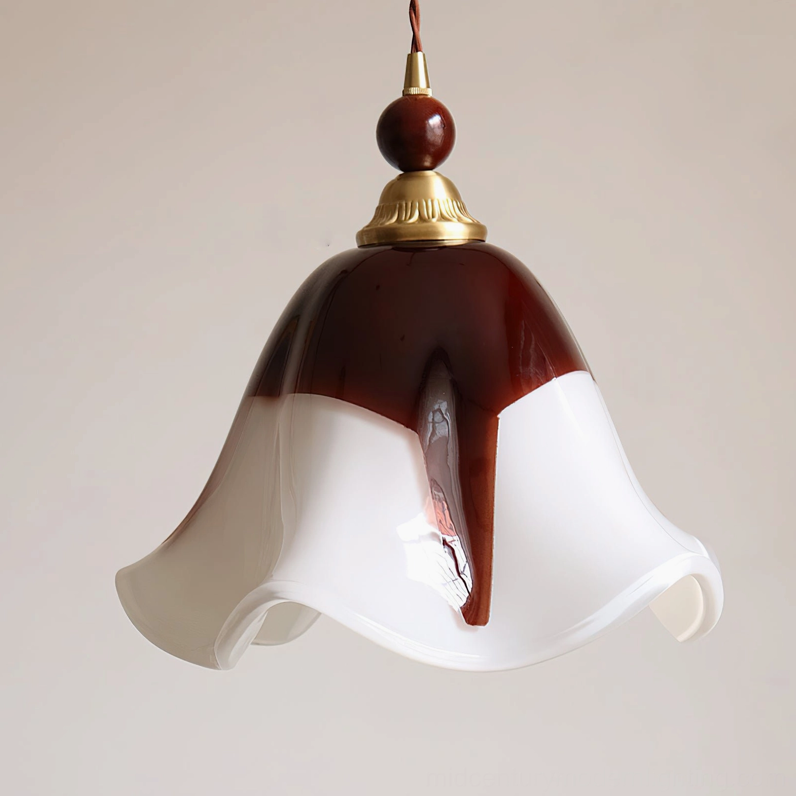 Close-up flat side view of Selene pendant light revealing glass color gradient and wavy shade design