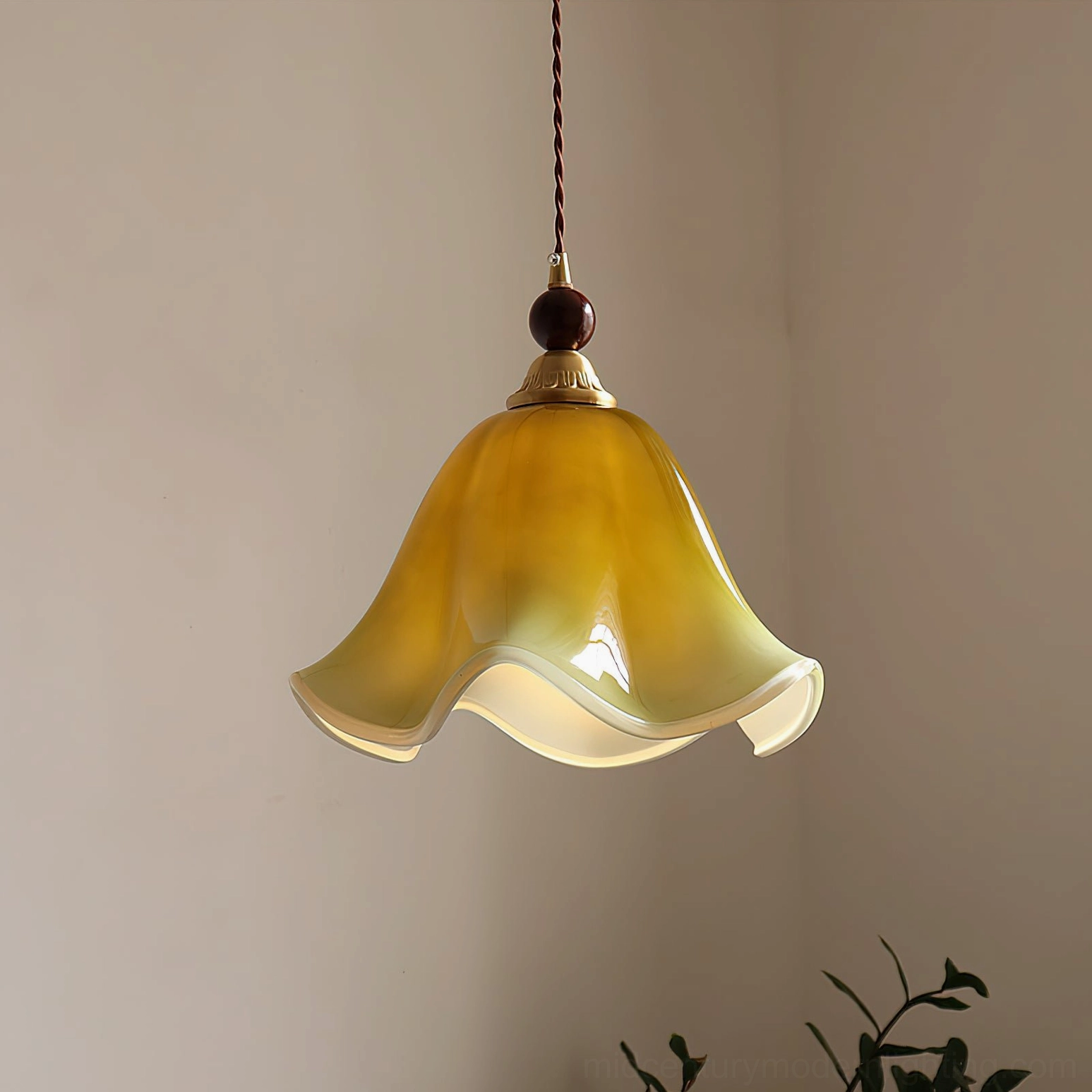 Yellow-cream gradient Selene botanical pendant light with dark walnut bead and twisted cord in contemporary room setting