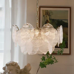 Seraphina Halo Chandelier lit overhead view in French vintage interior with warm yellow glow and frosted glass petals