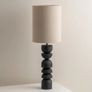 Mid-century modern Sergio table lamp three-quarter angle showing geometric stacked wood base detail