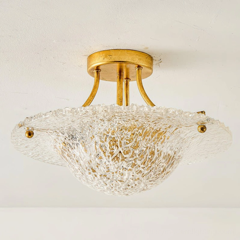 Serilda gold ceiling light with bright clear textured glass diffuser, flat overhead studio photography