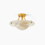 Serilda semi-flush ceiling light with brass gold hardware and clear textured glass shade, overhead view on white background