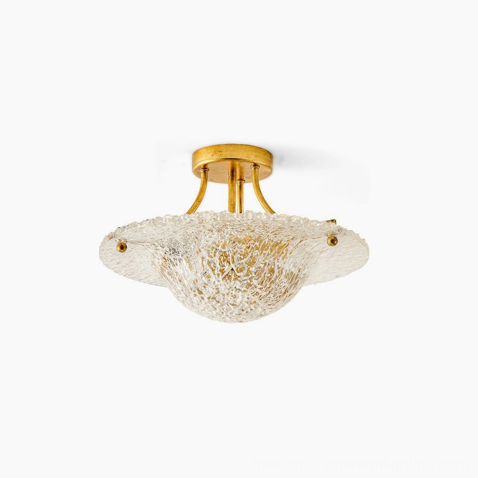 Serilda semi-flush ceiling light with brass gold hardware and clear textured glass shade, overhead view on white background