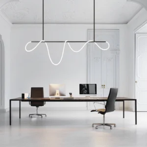 Modern serpentine wavy LED pendant light installed in contemporary home office space with warm white glow