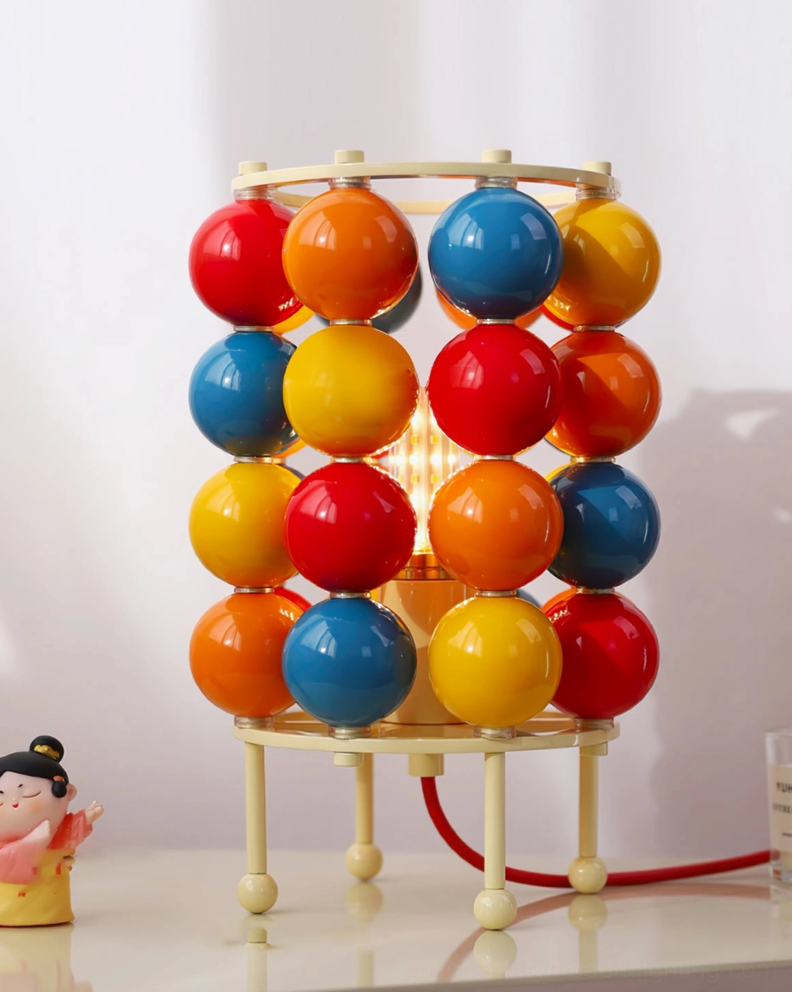 Interior view of Sfera ball lamp showing exposed mechanism and vibrant glossy sphere